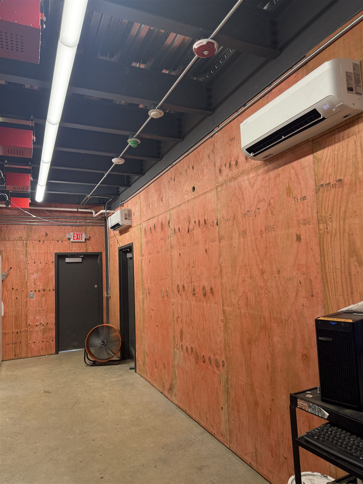 Tormenta ride equipment room with wall-mounted mini-split head and building systems installed by Phanton Mechanical