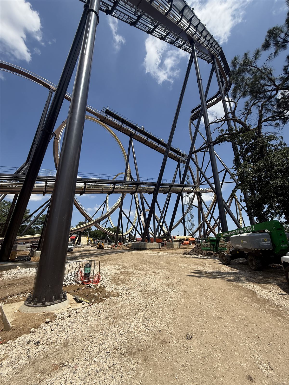 Steel support structure and track of the Tormenta giga dive coaster seen from ground level during construction