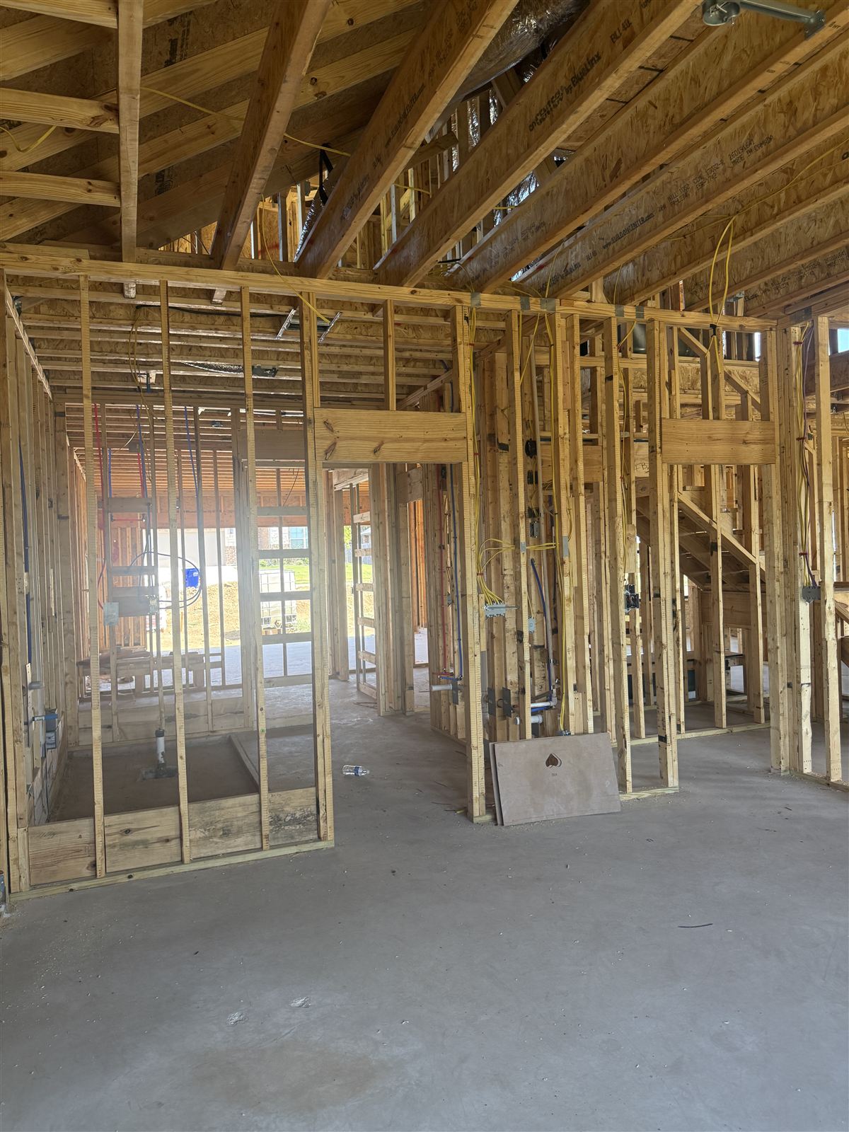 Electrical rough-in by Phanton Mechanical — wiring runs and boxes set through the framing of a new DFW home