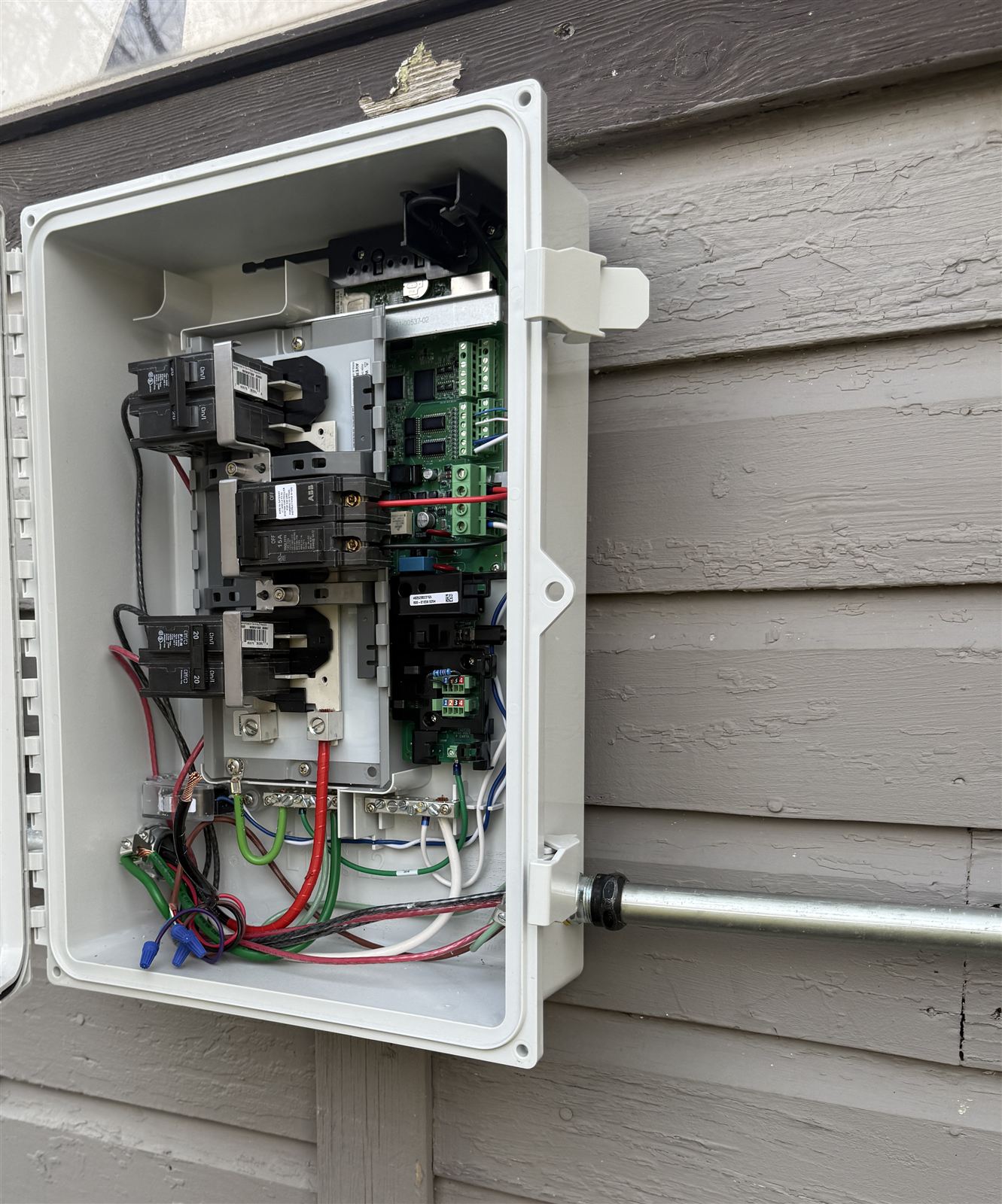 Wired Enphase IQ Combiner interior on a residential solar installation